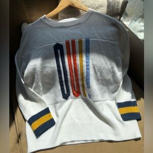 Chic White Sweater with Colorful Accents